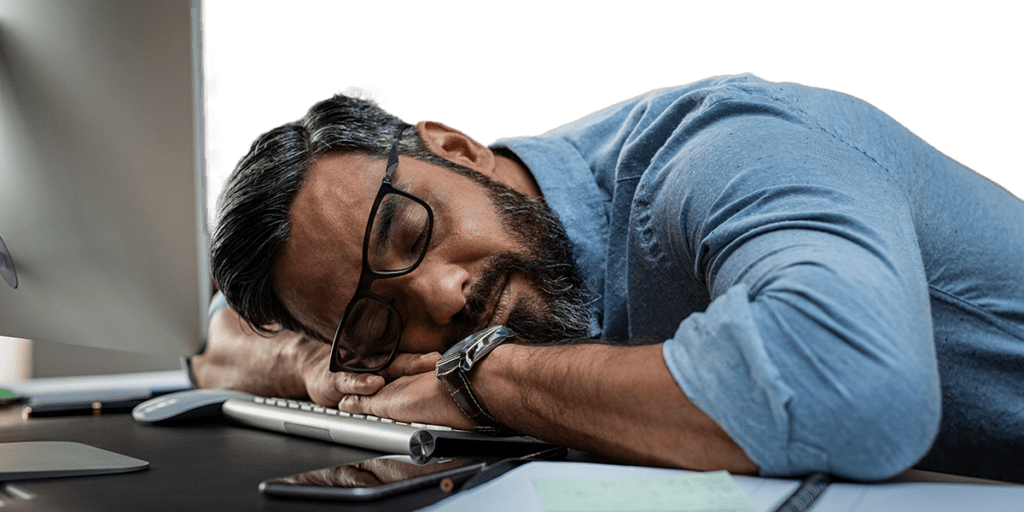 Social worker that's burned out from work and sleeping at desk